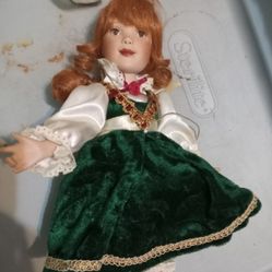 Paradise Galleries Christmas Maddy Sitting Porcelain Doll