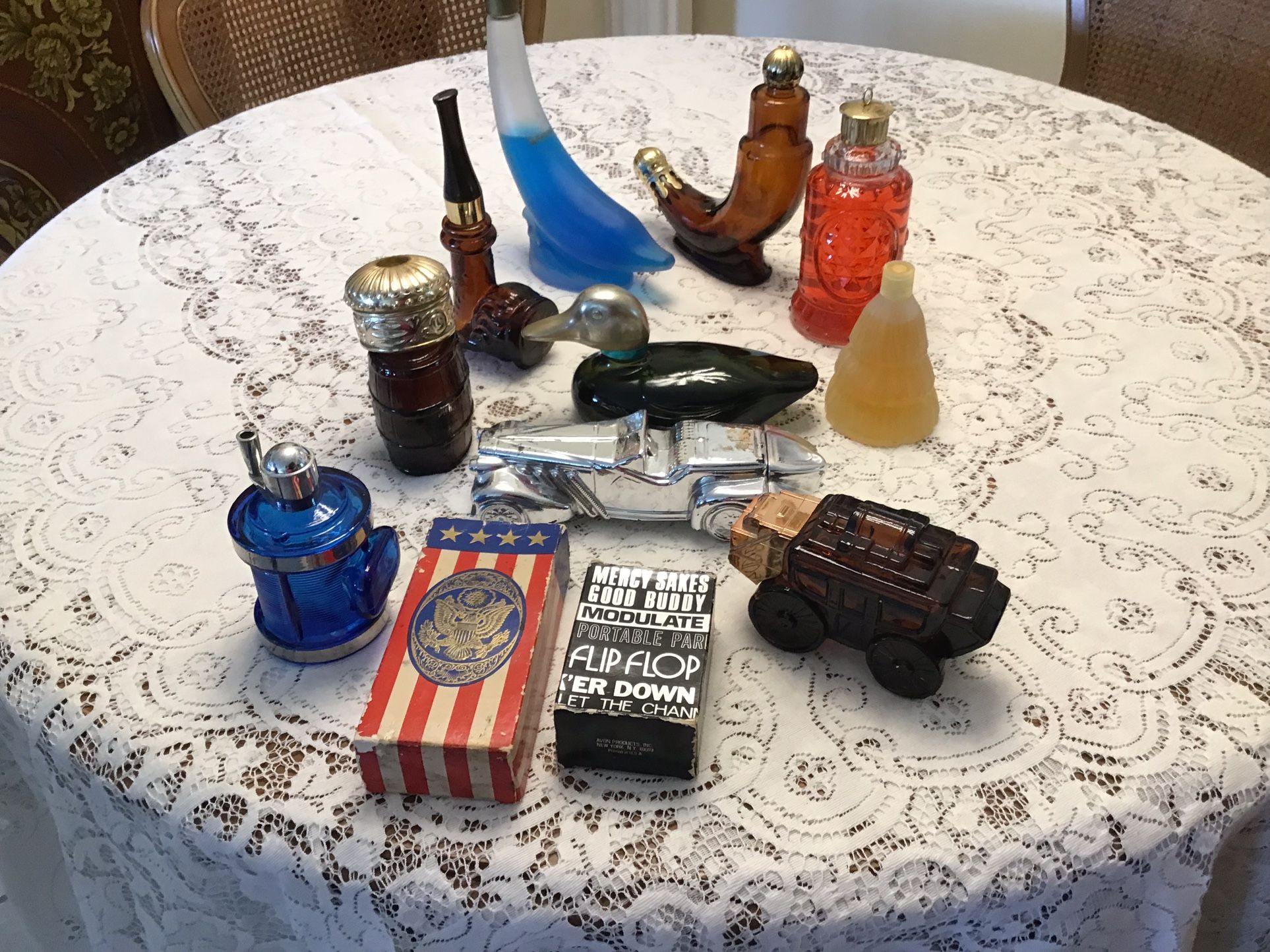 12 vintage Avon aftershave bottles and decanters.