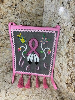 Handmade Native American Beaded Dance Bag Powwow Regalia featuring a Pink Breast Cancer awareness ribbon with traditional floral beadwork and feather
