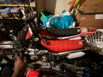 2 dirt bikes and a four wheeler