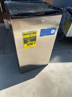 Brand new mini refrigerator with freezer