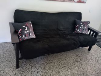 Futon with mattress and throw pillows