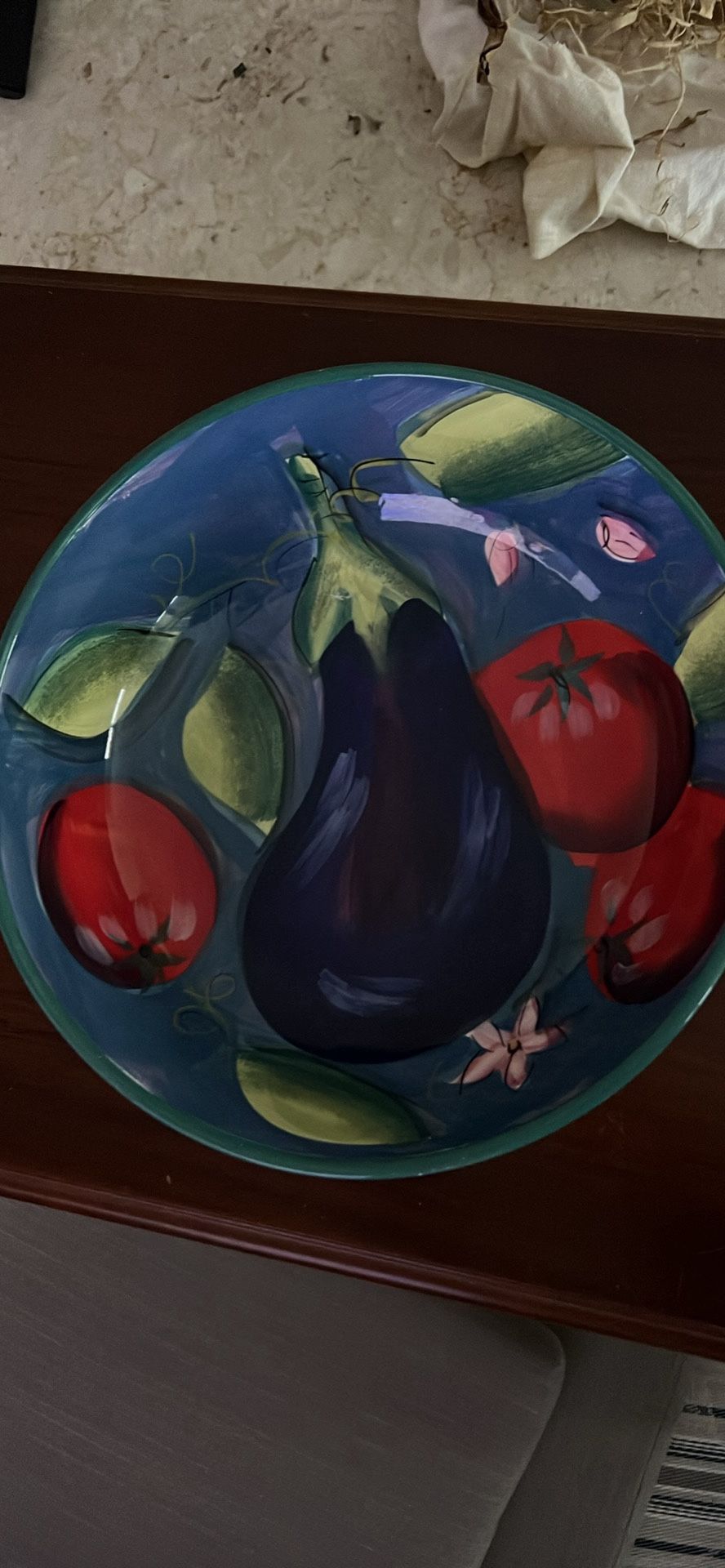 Certified International Provence 13" serving bowl featuring a Linda Montgomery design of painted vegetables. It is made of durable, glazed ceramic and