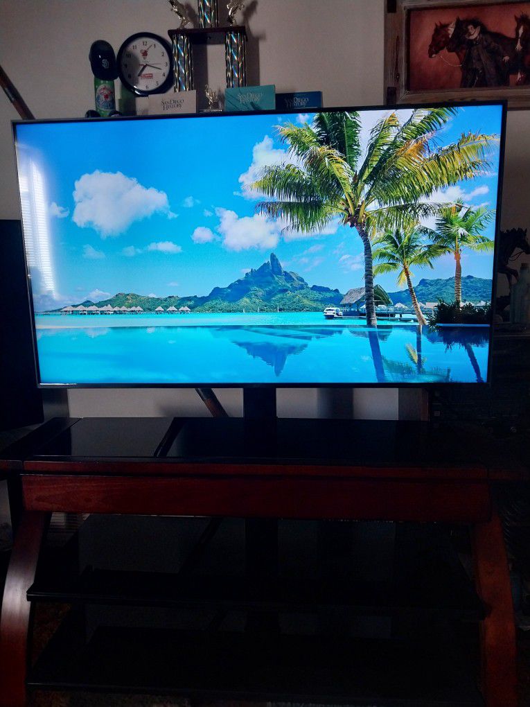55 Inch LG 4uk TV With Three Tier Black Glass Stand