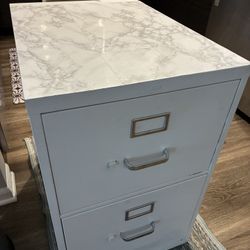 Large White w/tile top FILE CABINET Size: 29”T, 18”W, 25”D. The file jacket is 14”3/4 wide