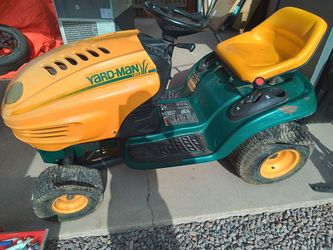 Yard Man Riding Lawnmower
