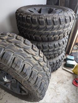 Mud Terrain Tires on Black Wheels Set of 4