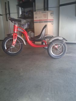 Schwinn Roadster Classic Red 12-inch tricycle.