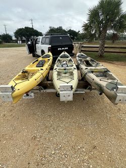 3 Kayaks And Trailer Plus Trolling Motor