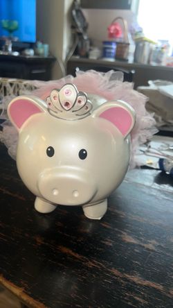 Piggy bank with pink crown and tutu