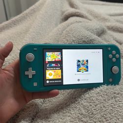 Nintendo Switch Lite + Pokémon + Charger – Works Perfect