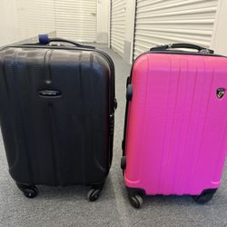 One pink Heys and one black Samsonite suite case
