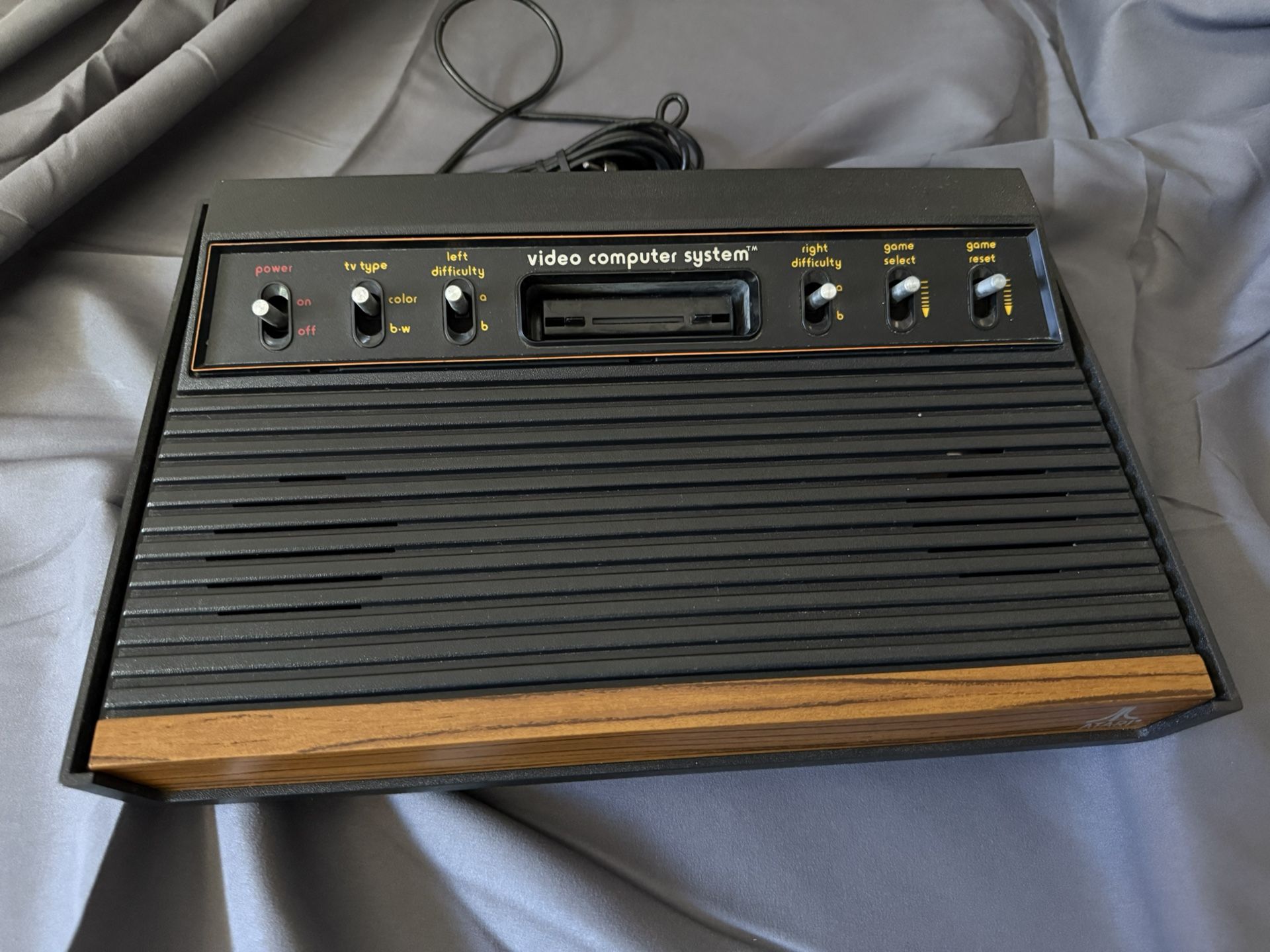 Atari 2600 console with joysticks, paddles and 16 games