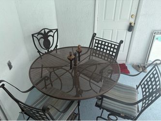 Iron table with four chairs