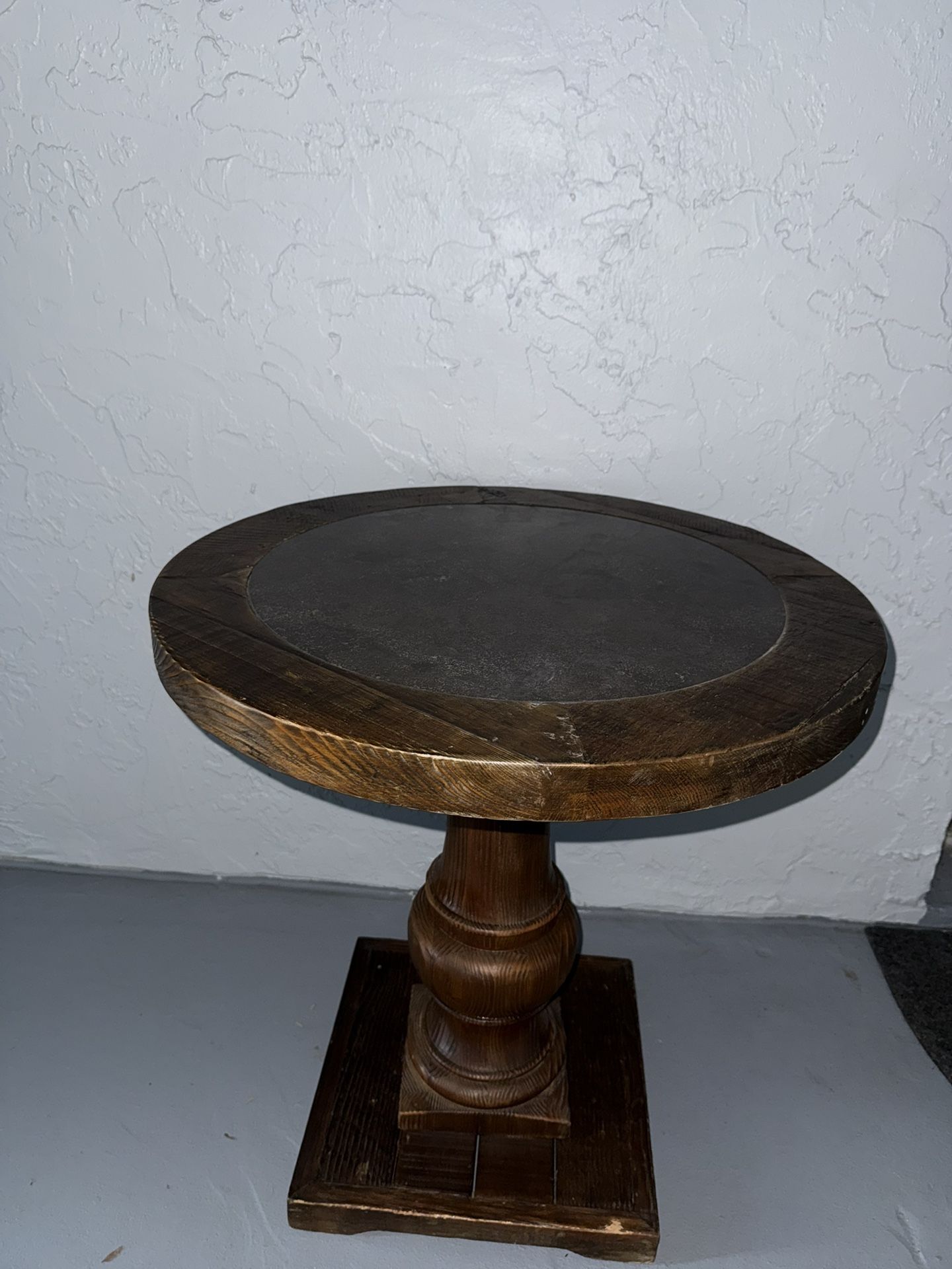 Rustic round wood pedestal side table with slate top