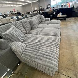 Brand new double chaise sectional with pull out bed and storage in both chaises $1275
