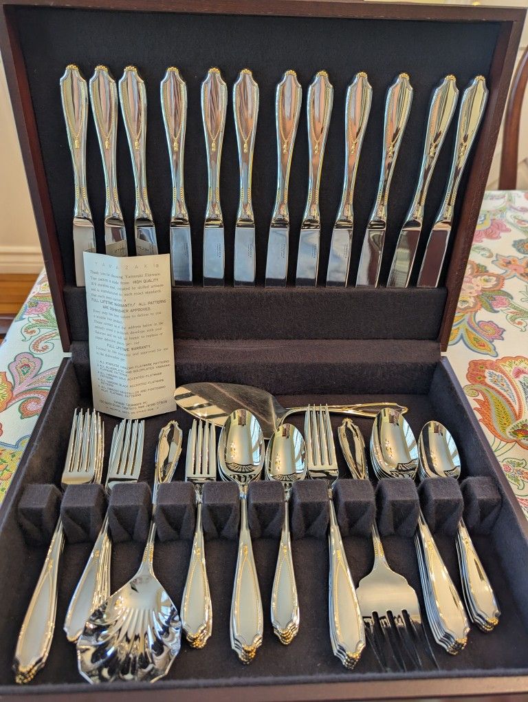 BRAND NEW, NO POLISHING REQUIRED!! PERFECT CONDITION YAMAZAKI SERVICE FOR 12 WITH EXTRA SERVING PIECES AND STORAGE BOX INCLUDED 