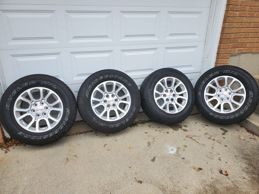 GMC Sierra 18inch rims with like new bridgestone tires