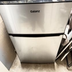 Small Refrigerator With A Freezer 