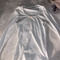 tight, white shirt with a little flower, size small