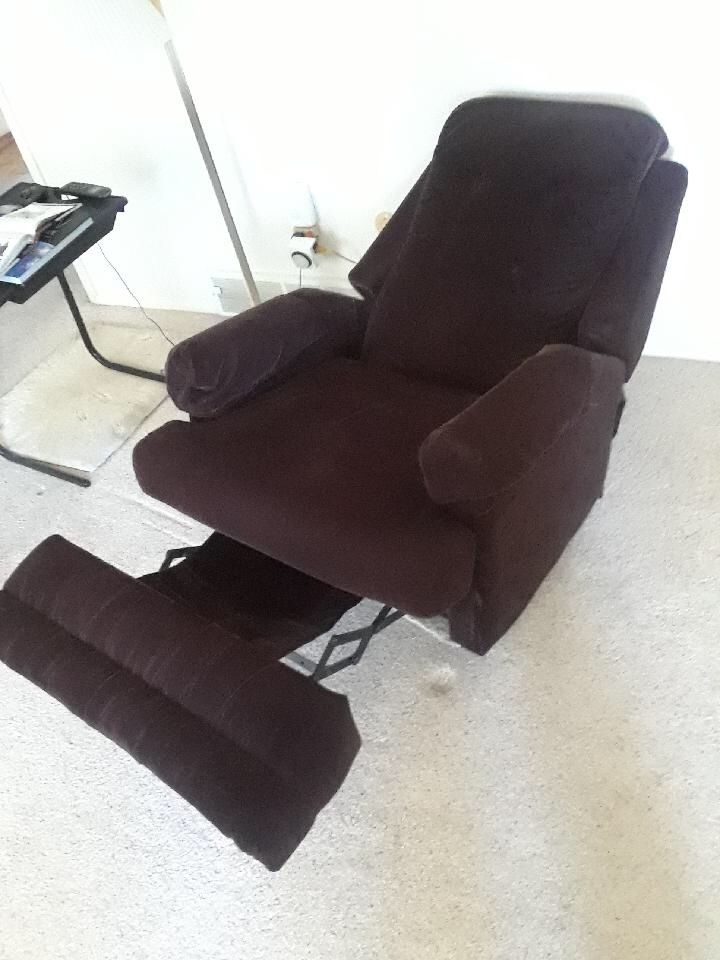 Brown upholstered recliner chair, good condition, living room furniture, reclining chair.