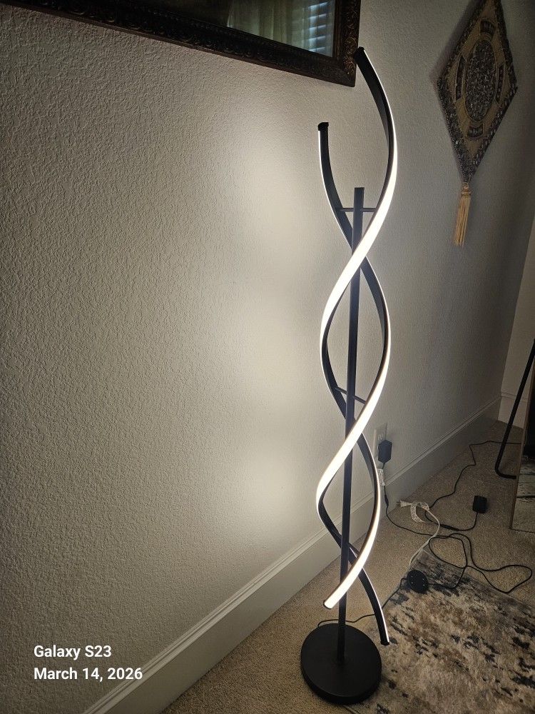 Stylish Dimmable LED modern floor lamp with a unique spiral design .