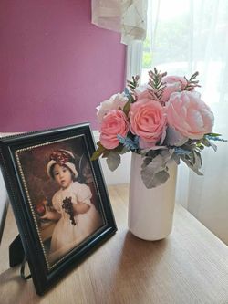 Pink and Blue Flower Arrangement on a White Ceramic Vase