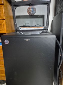 Large capacity Black Whirlpool washer.