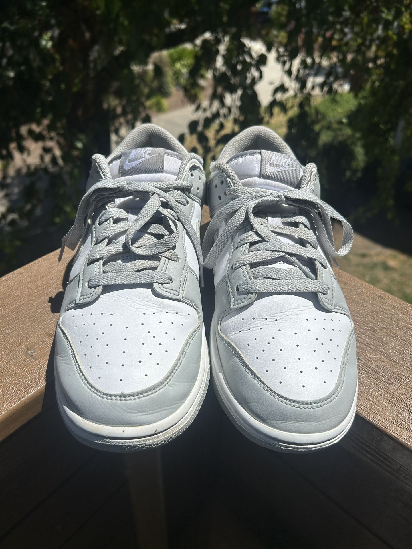 Nike Dunk Low sneakers in a light gray and white colorway