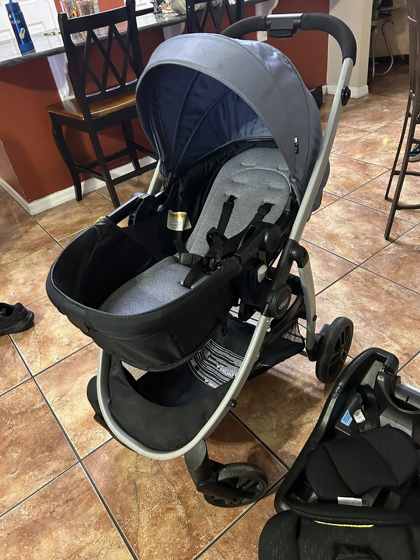 Baby Stroller Graco Pramette Model Light Blue And A Base For A Car Seat 