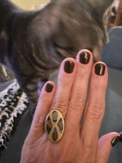 Modernistic oval-shaped face inlaid with fused dichroic glass in brass