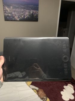 Wacom One animation drawing tablet , binders of pokémon and sports cards , airpods pro , and a wireless led lamp .