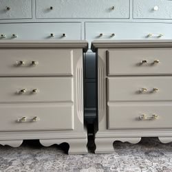 pair of refinished beige nightstands 