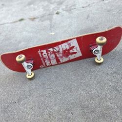 Popwar "Raise Questions" red skateboard deck. 