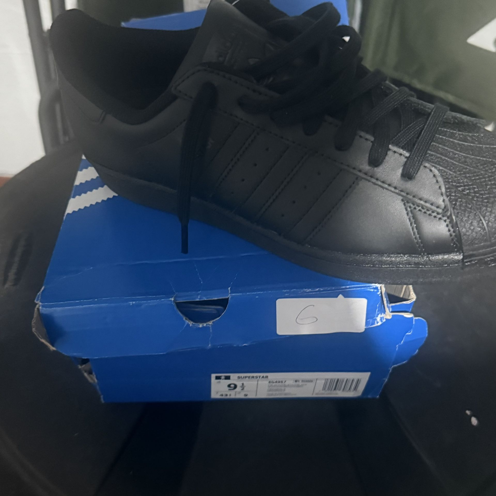 Size 9 1/2 Adidas superstar, black