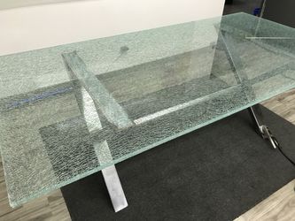 Modern glass table. Cracked glass top and steel frame