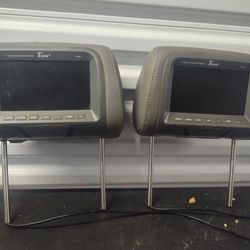 The image shows a pair of Tview T91PL-GR 9” Headrest Monitors

The image shows a pair of Tview T91PL-GR 9” Headrest Monitors, specifically in the grey