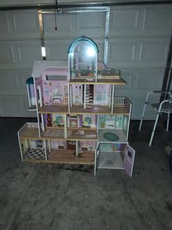 5'5" tall Wooden Doll House Like Brand New asking $60 obo