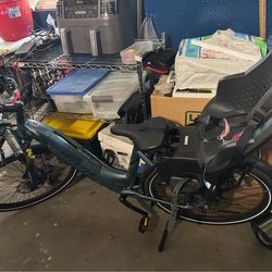 Aventon e bike with toddler Thule seat