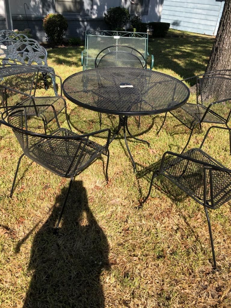 Wrought iron patio table and 5 chairs