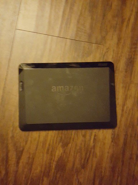 Kindle fire hdx with case and charging cable.