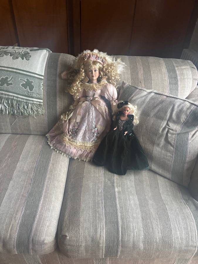 Two dolls 1 Barbie