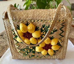 Vintage Bahamian hand-woven straw and Three-dimensional raffia tote bag featuring yellow sunflower appliqué