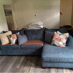 Sectional with full size memory foam mattress