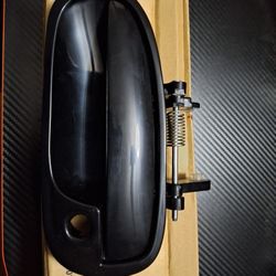 Ek Driver's side door handle.