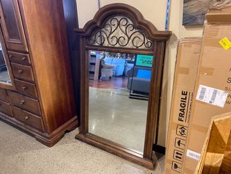 Rustic Arched Hanging Mirror with Scrolled Metal Details