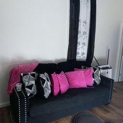 All black ,silver studded two sofa set