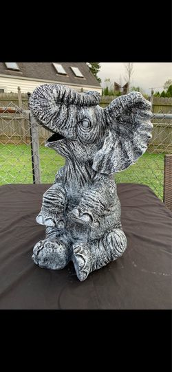 Large, happy elephant statue