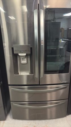 Black stainless steel French door fridge with knock door