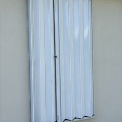 Used Accordion Hurricane Shutters – Full House Set – Large Sliding Door Included – Good Condition – Pickup in Hobe Sound